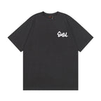 The T-shirt is an EVISU short-sleeve tee featuring a skull and large "M" print.