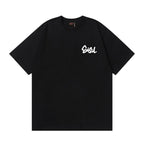 The T-shirt is an EVISU short-sleeve tee featuring a skull and large "M" print.