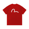 The T-shirt is an EVISU short-sleeve tee featuring a skull and large "M" print.