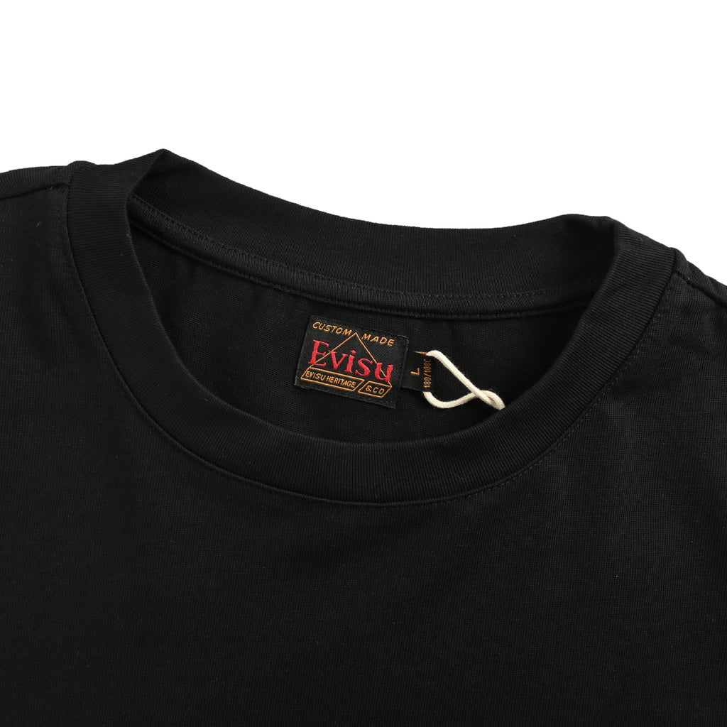 The T-shirt is from EVISU's "Heart-Hand Buddha Head" series.