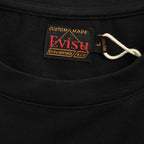 The T-shirt is from EVISU's "Heart-Hand Buddha Head" series.