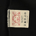 The T-shirt is from EVISU's "Heart-Hand Buddha Head" series.
