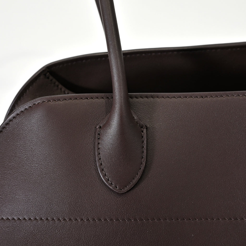 The Row Margaux 15 Smooth Calfskin Handbag | Large Leather Tote with Side Buckles | Black / Dark Chocolate