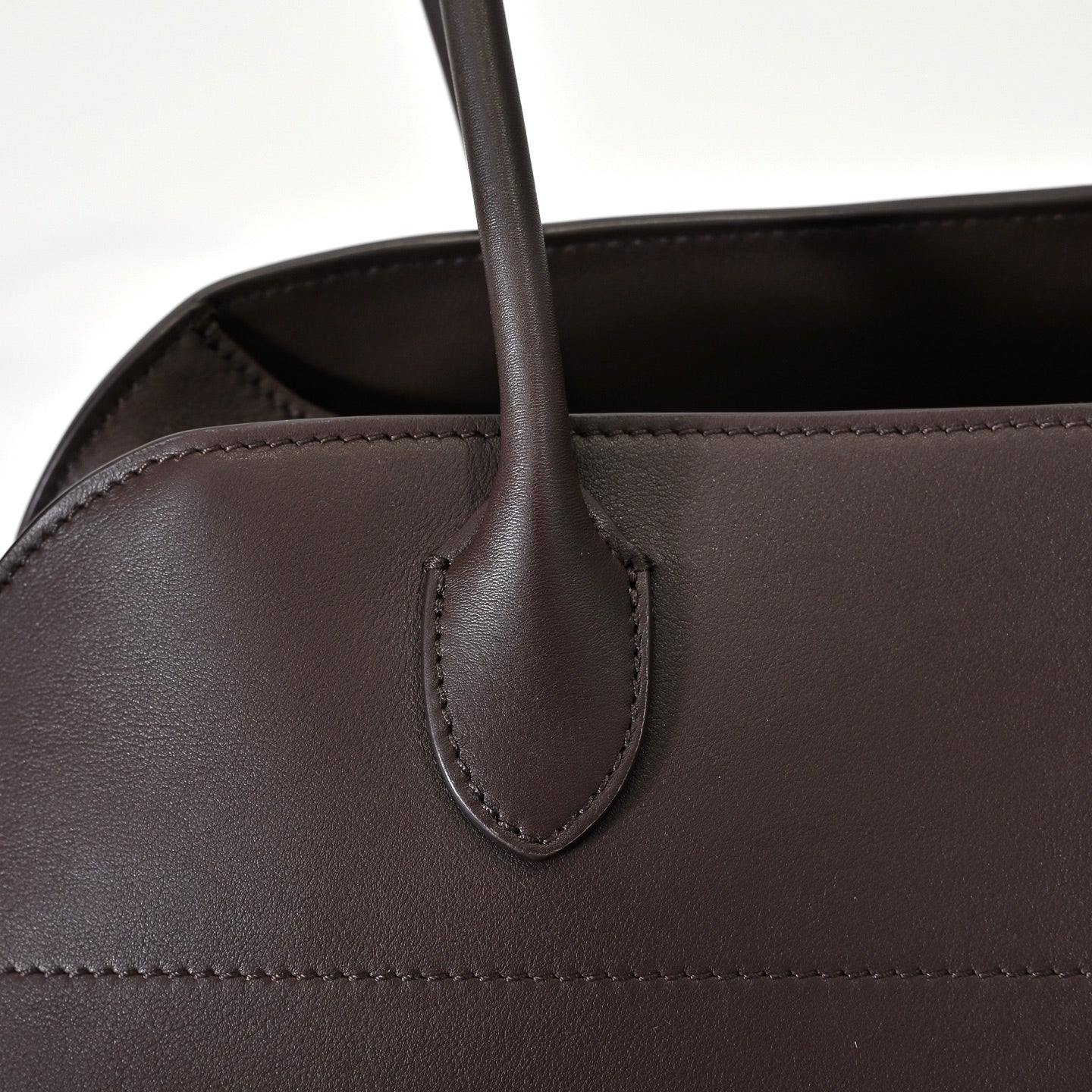 The Row Margaux 15 Smooth Calfskin Handbag | Large Leather Tote with Side Buckles | Black / Dark Chocolate