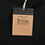 The T-shirt is from EVISU's "Heart-Hand Buddha Head" series.