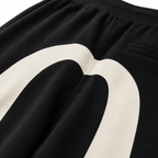 EVISU Solid-Color Athletic Shorts with Large "M" Print