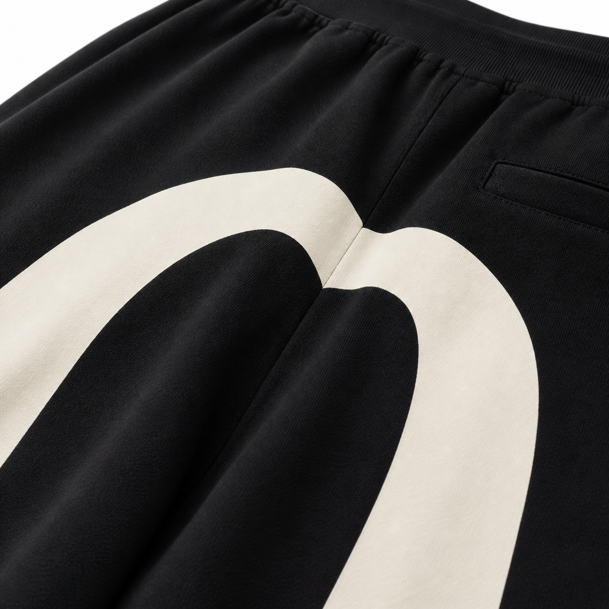 EVISU Solid-Color Athletic Shorts with Large "M" Print