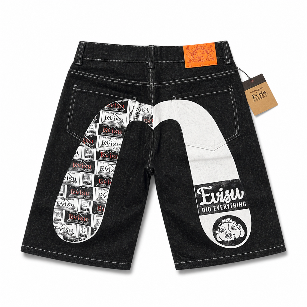 EVISU Denim Shorts featuring a Distressed, Paneled "Big M" Print