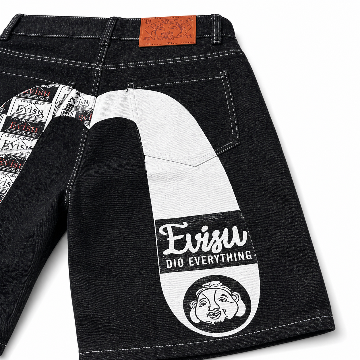 EVISU Denim Shorts featuring a Distressed, Paneled "Big M" Print