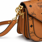 MCM Patricia Visetos Mini Saddle Bag – Cognac Monogram, Gold Hardware