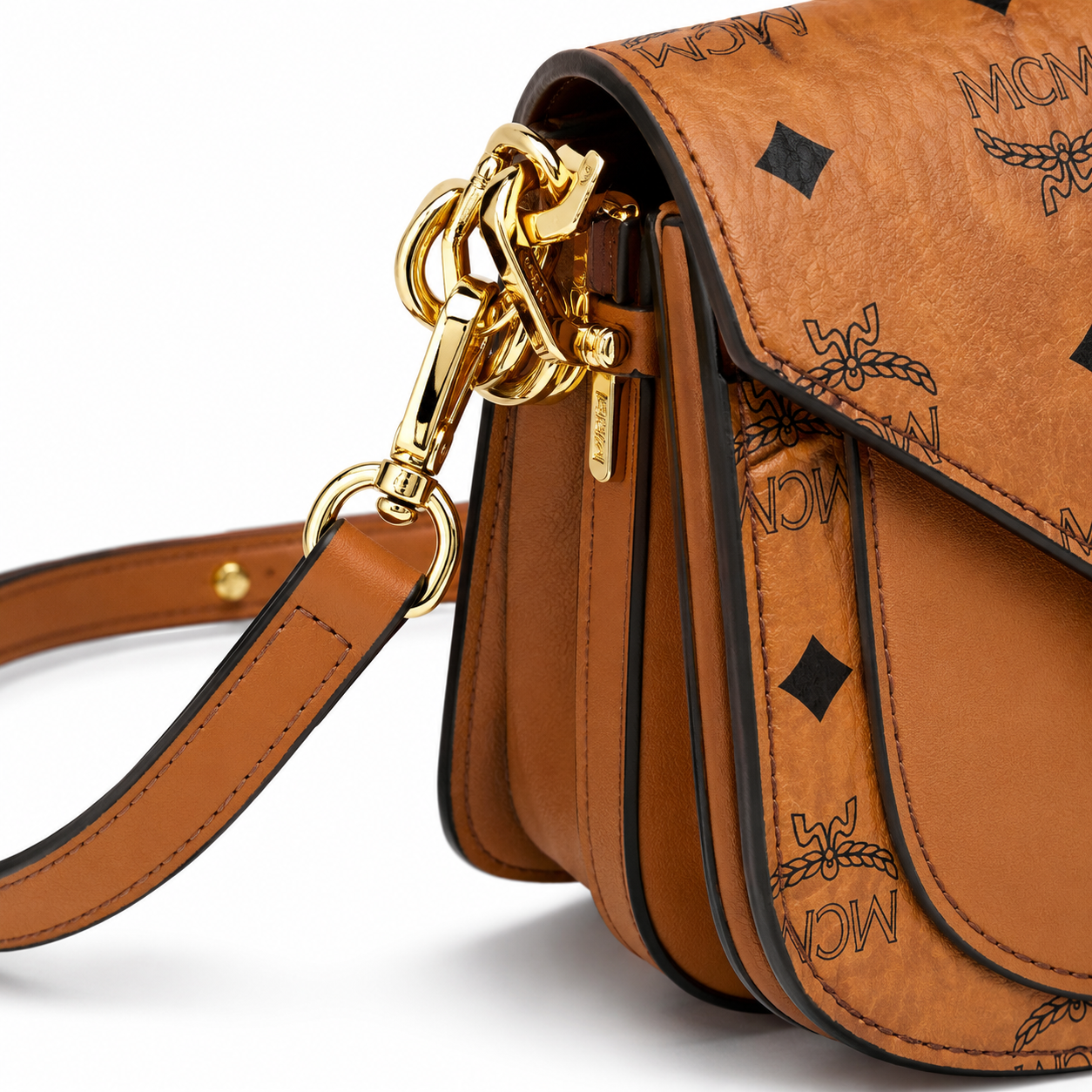 MCM Patricia Visetos Mini Saddle Bag – Cognac Monogram, Gold Hardware