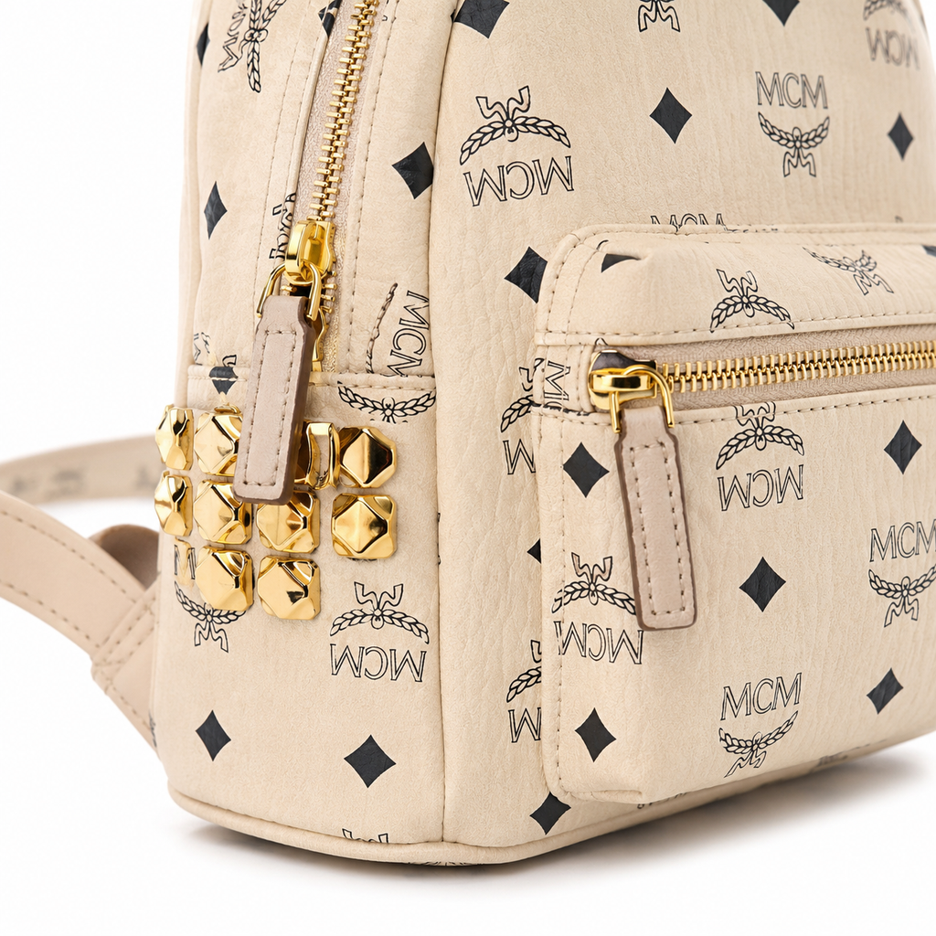 MCM Stark Mini Backpack in Beige Visetos – Signature Monogram Side Studs Backpack, MMK6SVE41IG001, 26x21.5x10.5cm