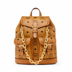 MCM Aren Mini Drawstring Chain Backpack in Cognac Visetos – Signature Monogram with Gold Chain Detail