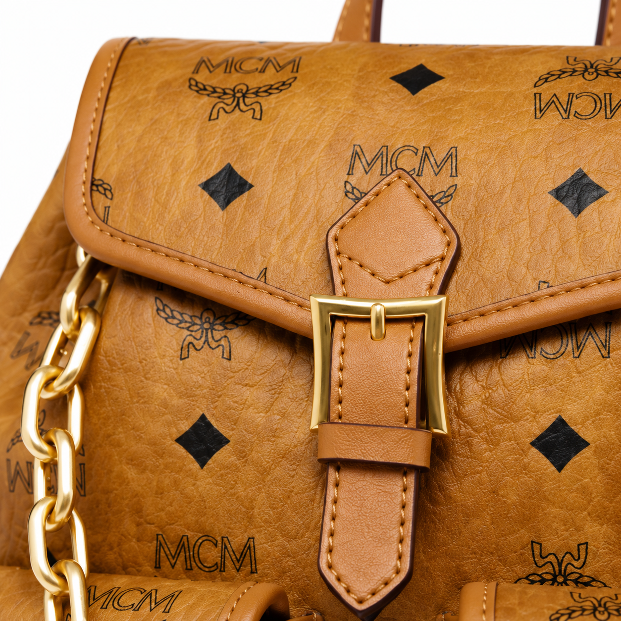 MCM Aren Mini Drawstring Chain Backpack in Cognac Visetos – Signature Monogram with Gold Chain Detail