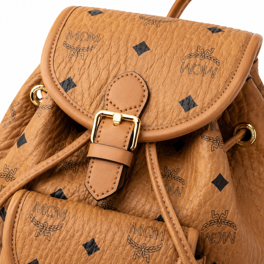 MCM Aren Visetos Drawstring Backpack in Cognac – Classic Monogram Coated Canvas Mini Rucksack with Leather Trim