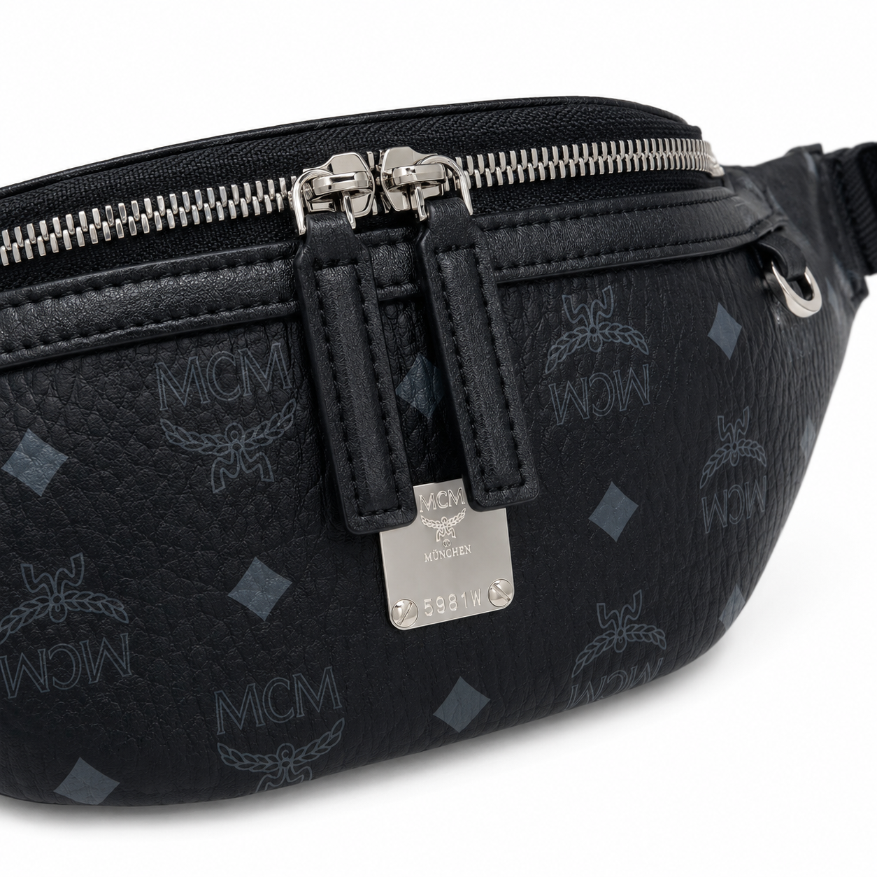 MCM Visetos Leather Belt Bag in Black – Pebbled Leather Mini Waist Bag with Tonal Embossed Monogram & Silver Plaque, 12x34x7cm