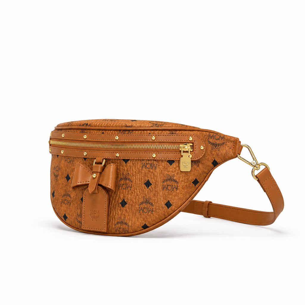 MCM Visetos Belt Bag with Bow in Cognac – Monogram Coated Canvas Waist Bag with Leather Bow, Rivets & Detachable Leather Strap, 25x18cm