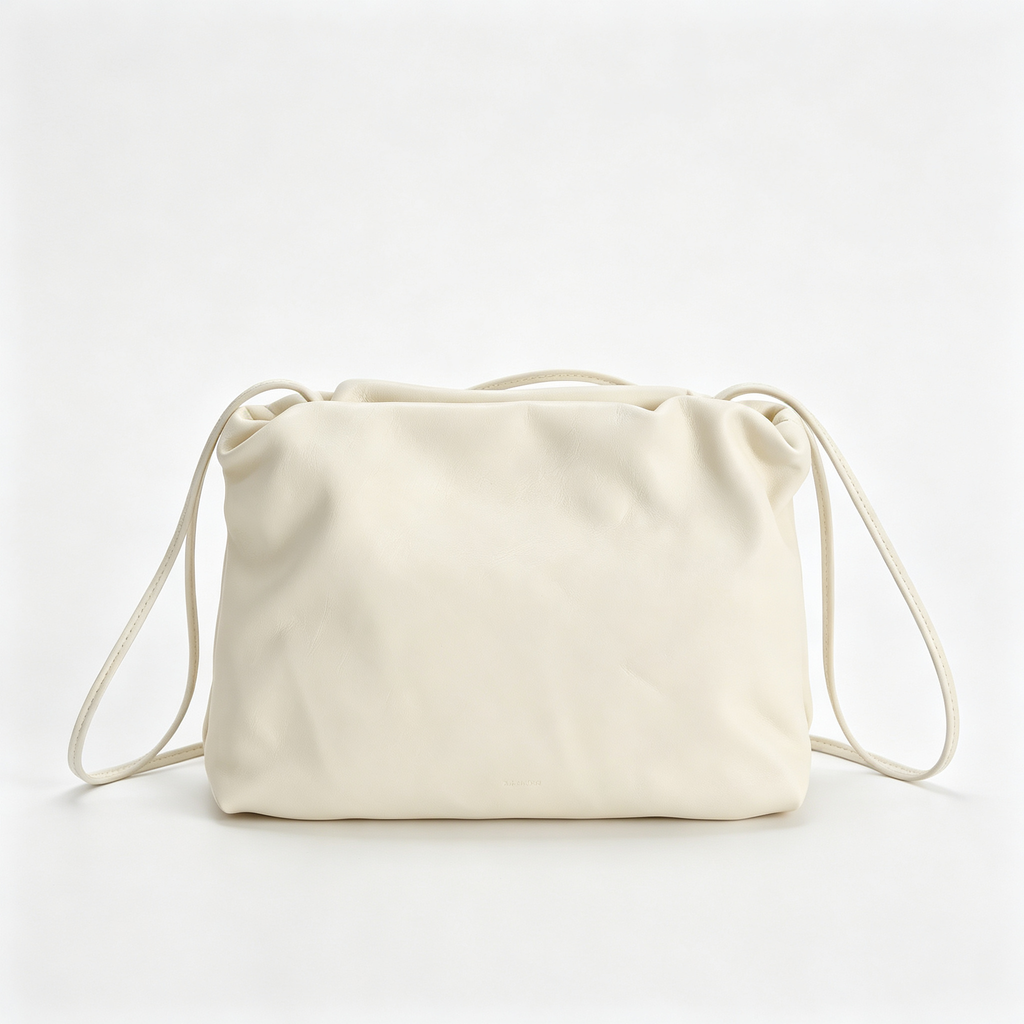The Row Bourse Small Grained Leather Bag | 23cm Drawstring Dumpling Bag | Cream Pebbled Calfskin Crossbody